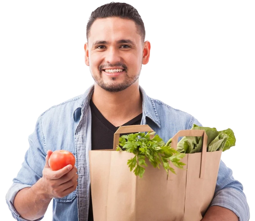 Good looking latin man carrying bag groceries showing all healthy food